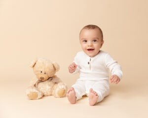 Baby boy with Teddy bear at photo studio in Somerset