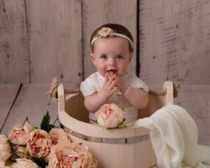 Baby girl at photo session with flowers