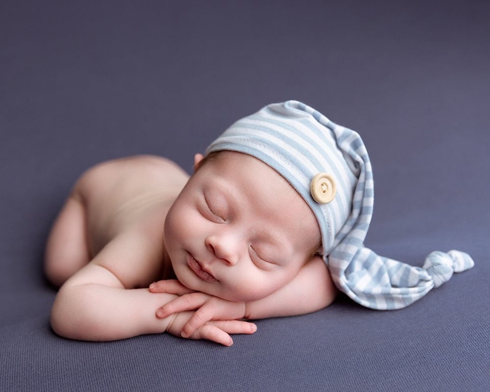 Newborn boy sleeping in a pose by Bridgwater photographer