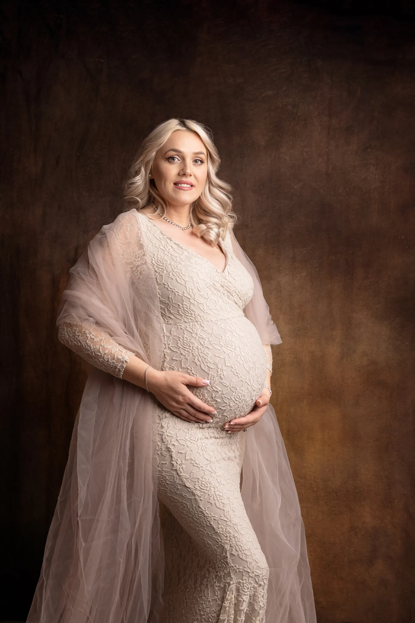 Stefania-20-2048 Maternity image of lady in beige maternity gown