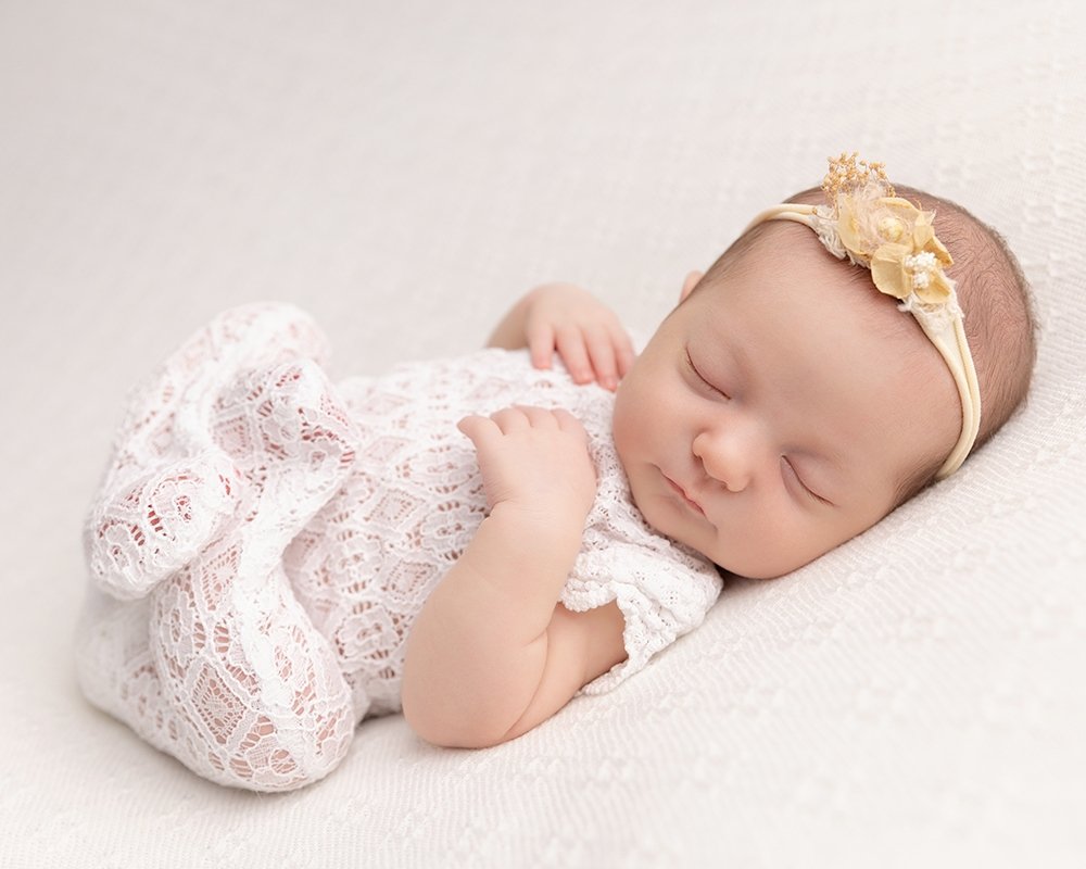 Newborn girl with cute outfit and headband